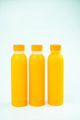 Three bottles of delicious orange juice