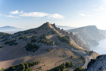 Long windy road bending around tall sandy mountains along the Pacific Northwest coast