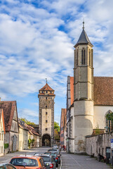 Fototapeta na wymiar Rothenburg ob der Tauber, Germany. The Spital-Kirche bell tower, in the background the Spitalturm tower