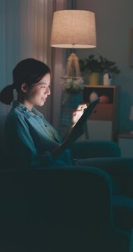 woman using phone at night