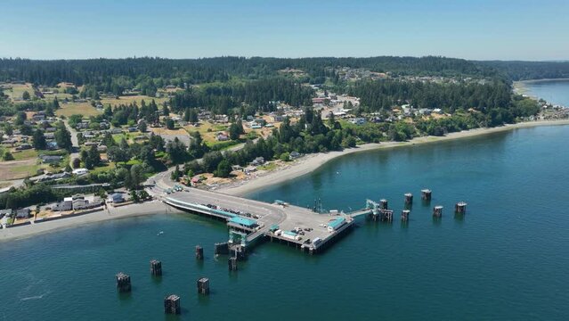 High up aerial view of cars lining up to board the Clinton ferry on Whidbey Island.