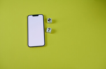A close-up white background of the phone screen with a space for text and dice with the image of a planet and a question mark on a yellow background.