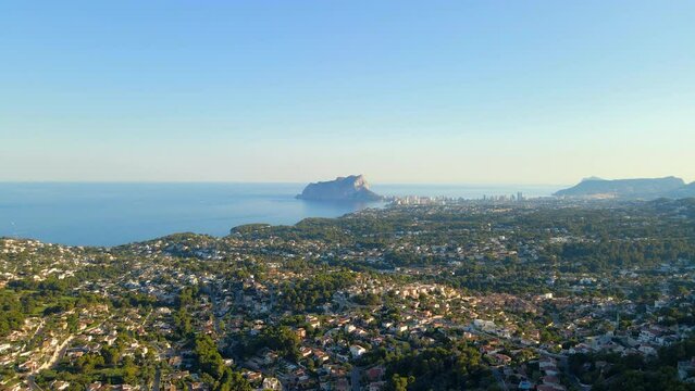 Aerial view of Calpe, the Penon de Ifach and surroundings in the background on the Costa Blanca, Alicante, Spain.