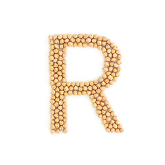 Capital letter R made from chickpea beans. Dry chick pea font. Alphabet made from gram . White background