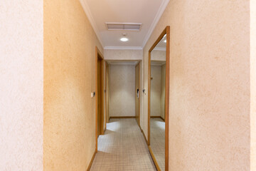 Interior of a hotel corridor with doors