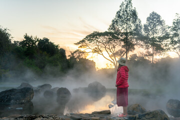 Young traveler woman at hot springs, Chae Son National Park, Thailand.