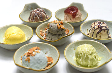 Organic ice cream in bowls on white background closeup
