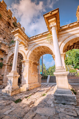 Vertical dramatic view of famous gate or Hadrianus arch in Antalya without visitors. Travel landmarks and must-see tourist and sightseeing sites in Turkey