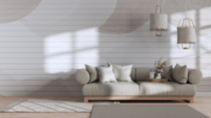 Fototapeta na wymiar Blurred background, wabi sabi living room with copy space. Wooden and fabric sofa with pendant lamps. Japandi interior design