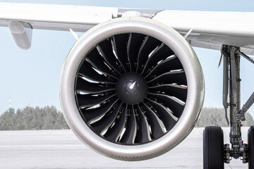 Close-up of engine of big passenger airliner - obrazy, fototapety, plakaty