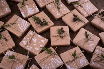 Obraz na płótnie Canvas Christmas gift boxes in craft paper