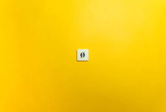 Solidus or Slash Diacritical Mark on Letter Tile on Yellow Background. Minimal Aesthetics.