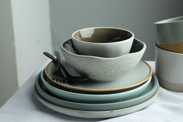 Stylish empty dishware and cutlery on table indoors