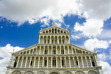 Fototapeta premium The Square of Miracles of Pisa, with the Cathedral dedicated to Santa Maria Assunta, the baptistery, and the Leaning Tower of Pisa.