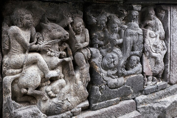 Carving Relief In Prambanan Temple. The temple is adorned with panels of narrative bas-reliefs telling the story of the Hindu epic Ramayana and Bhagavata Purana.