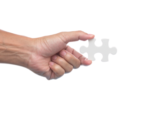 Hand with jigsaw puzzle isolated