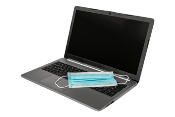 Surgical mask on a laptop computer