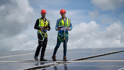 Construction workers clean solar panels for energy.Renewable Energy Battery Clean Mountain Climber...