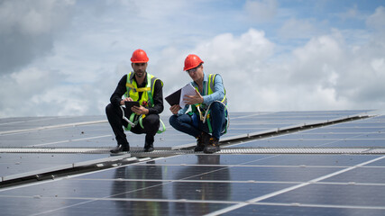 Construction workers clean solar panels for energy.Renewable Energy Battery Clean Mountain Climber Activities Work Uniforms.Managers discuss electric power ecology, human, renewable energy.
