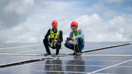 Construction workers clean solar panels for energy.Renewable Energy Battery Clean Mountain Climber...