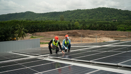 Construction workers clean solar panels for energy.Renewable Energy Battery Clean Mountain Climber...