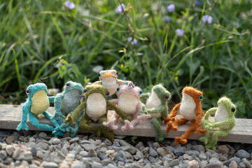 knitted frogs on the grass