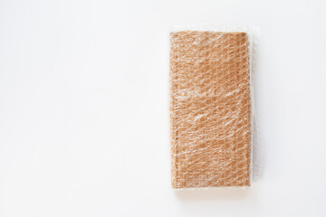 Bubbles covering the box by bubble wrap for protection product cracked isolated white background
