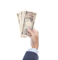 Man hand holding 10000 Japanese Yen banknote