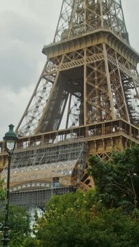Bottom view of the Eiffel Tower on a sunny summer day