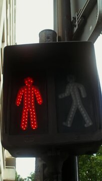 Close-up of a traffic light for a pedestrian changing color