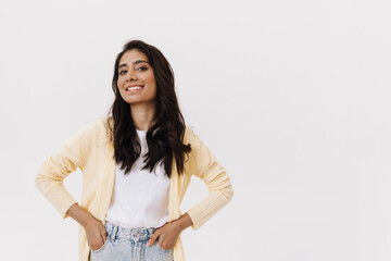 Young brunette indian woman posing and smiling at camera
