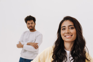 Young indian couple looking at camera while posing together