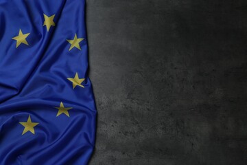 Flag of European Union on grey stone background, top view. Space for text