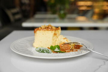 Tasty dessert on white table in cafeteria