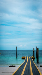 pier in the sea with blue sky