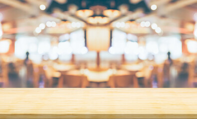 Empty wood table top with cafe restaurant interior blurred background