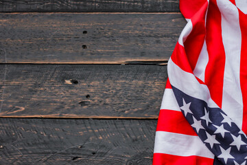 american flag placed on a black wooden table On American Independence Day.