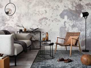 Exquisite and modern composition of living room interior with design grey sofa, chair, round pedant...