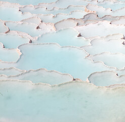 Emerald water in white limestone rock.