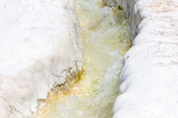 Stream in white volcanic rock.