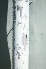 Old drain pipe against the wall