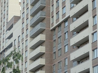 Full-color horizontal photo. Linear geometric composition. An inanimate landscape of parts of the facades of city buildings.