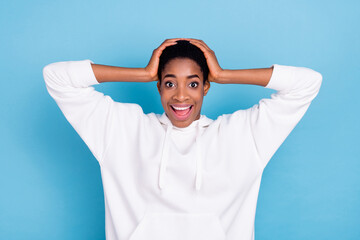 Photo of youth cheerful man woman excited reaction news hands touch head isolated over blue color background