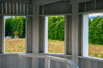 Fototapeta premium old wooden antique windows with green grass and blue sky
