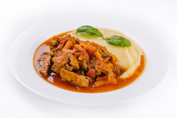 lunch with beef bourguignon stew served with mashed potatoes on a plate