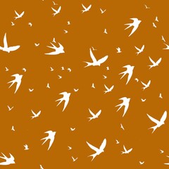Seamless pattern swallows on orange background
