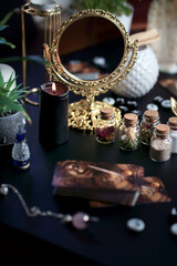 Blurred esoteric magic objects tarot cards on witch table altar