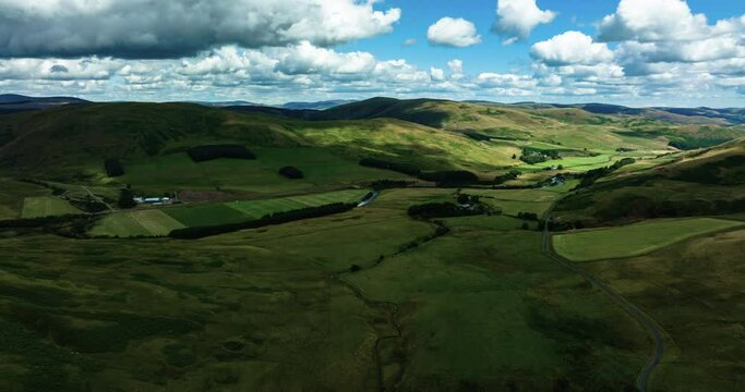 aerial view of the scottish borders countryside near moffat on a blue sky day with clouds during a day in the summer