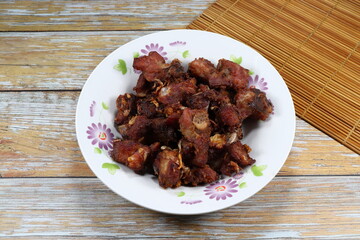 Traditional deep fried sour pork serving on the plate. Famous appetizer menu in Asia restaurant.