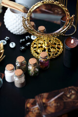 Blurred esoteric magic objects tarot cards on witch table altar